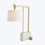 Elegant and contemporary gold table lamp with geometric design.