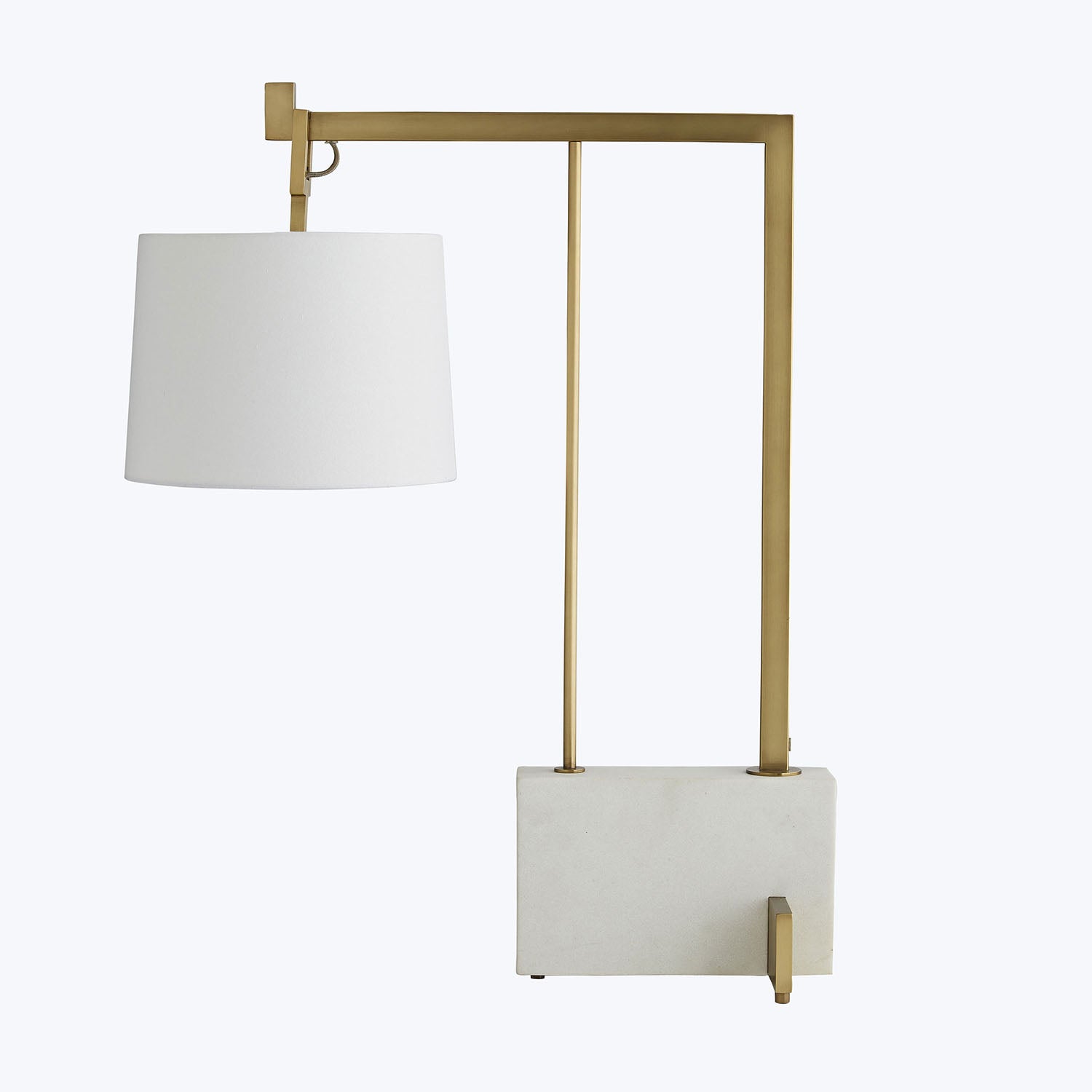 Modern geometric floor lamp with brass frame and white lampshade.