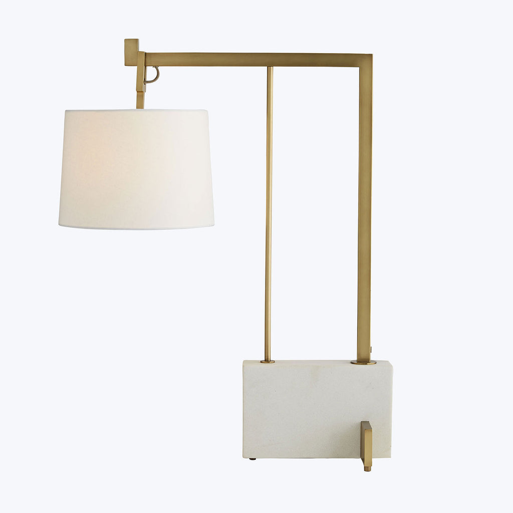 Contemporary table lamp with geometric design and elegant gold accents.