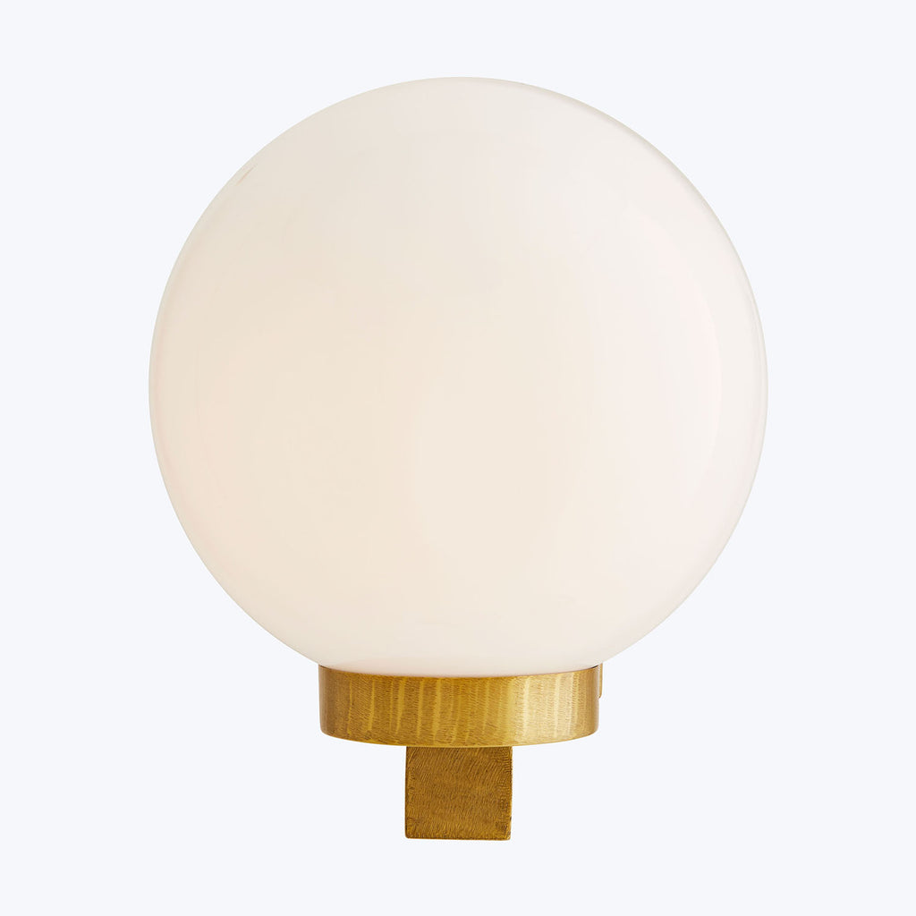 Minimalistic frosted glass lamp with golden metallic base and stem.