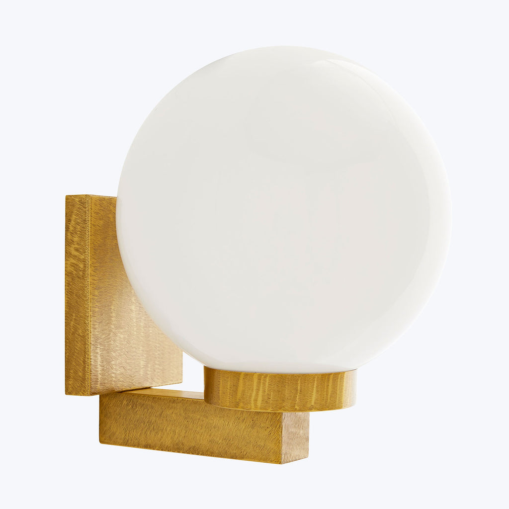 Contemporary wall light fixture with frosted glass globe and gold bracket.