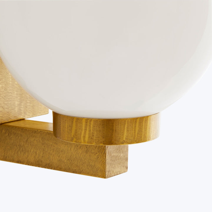 Contemporary glass and metal decorative piece exudes minimalist elegance.