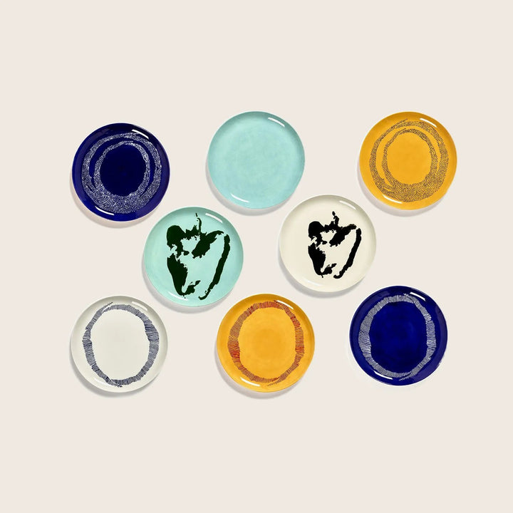 Collection of decorative plates with unique designs and color schemes.
