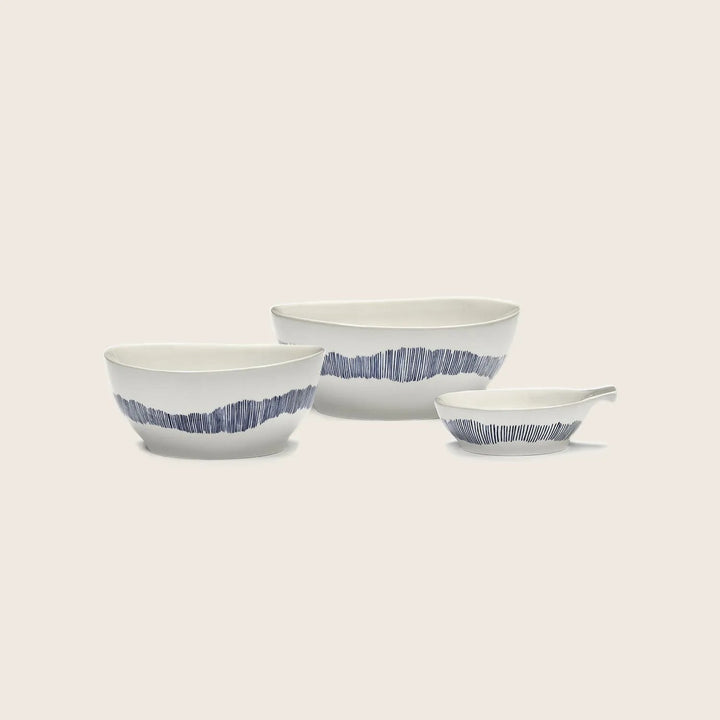 Set of three modern ceramic dishes with blue decorative pattern.