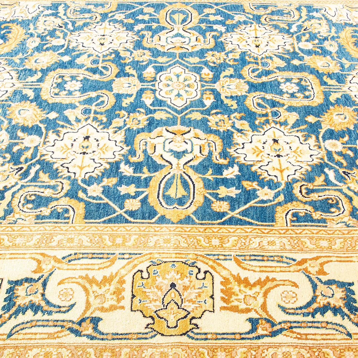 Close-up of an ornate Oriental carpet showcasing intricate designs.