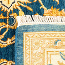 A close-up of a intricately designed handcrafted woven rug.