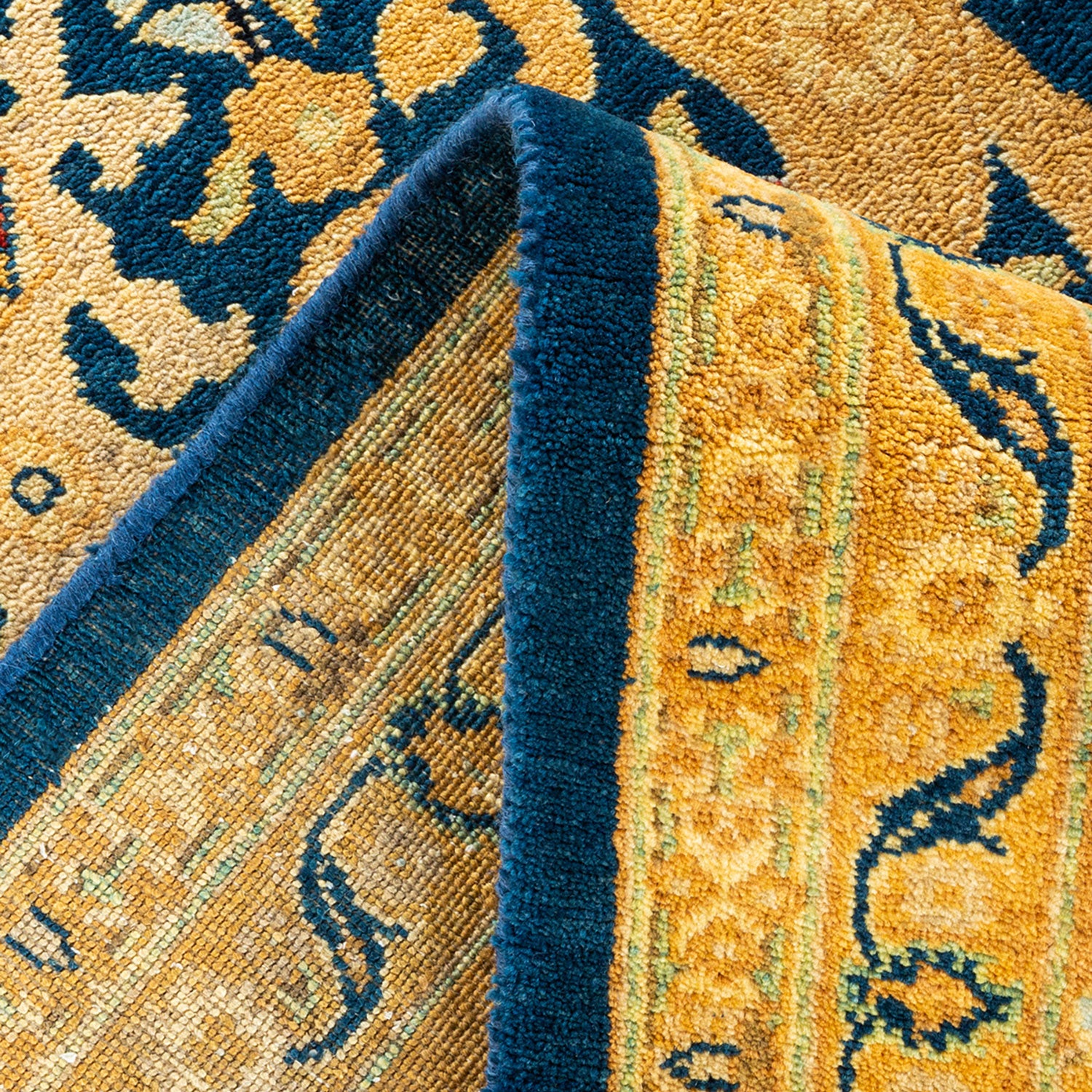 Close-up of a colorful, patterned rug with intricate designs.