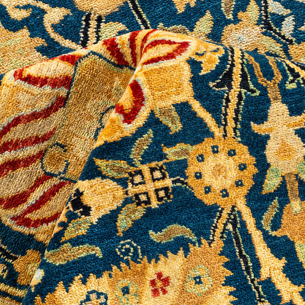 Exquisite hand-woven rug with intricate floral and geometric patterns.