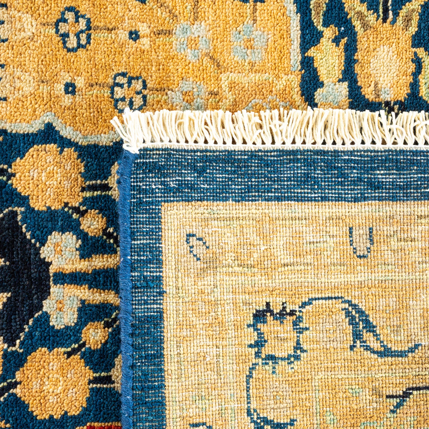 Contrasting rugs showcase intricate traditional design and high-quality craftsmanship.