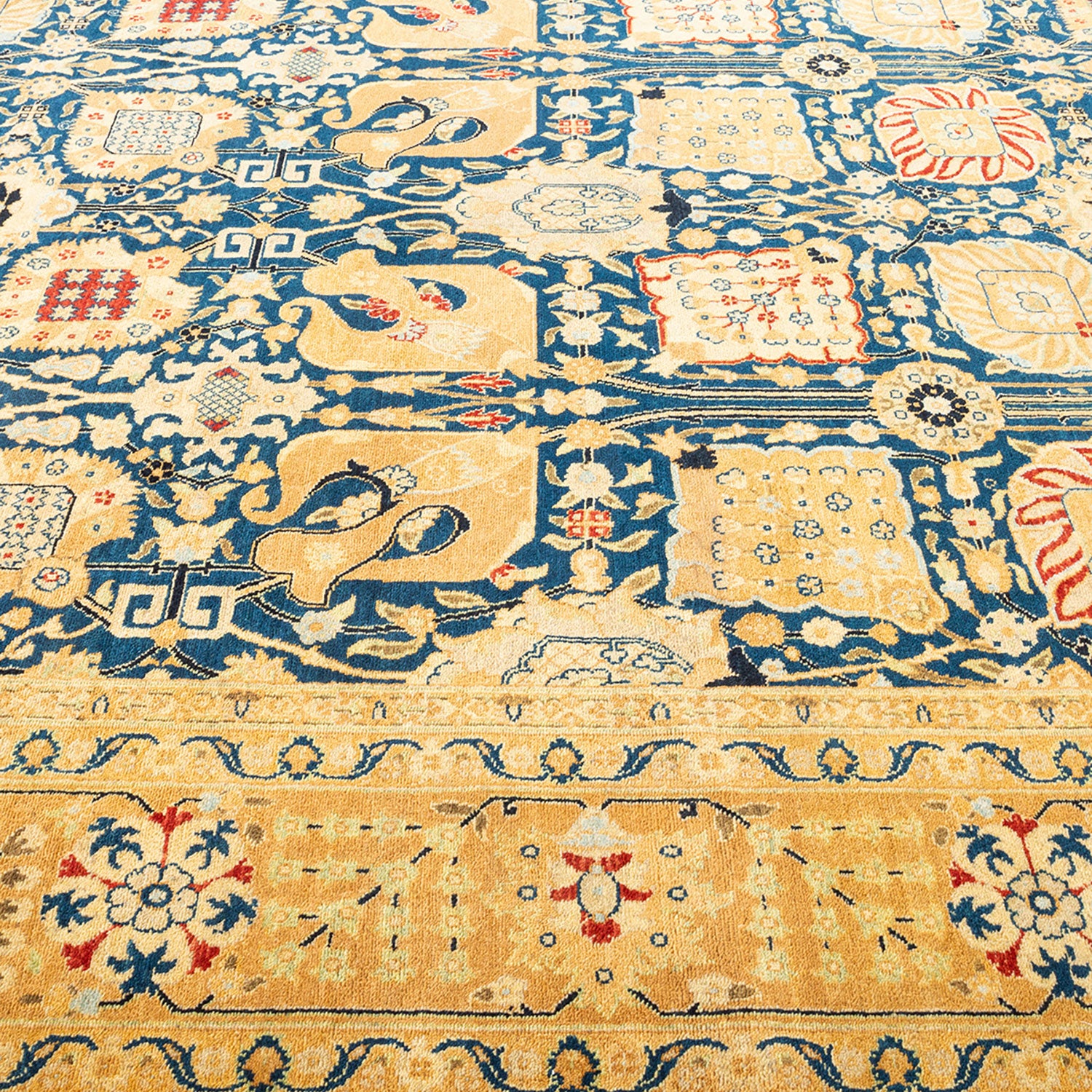 Intricate, symmetrical handwoven carpet showcases rich colors and intricate patterns.