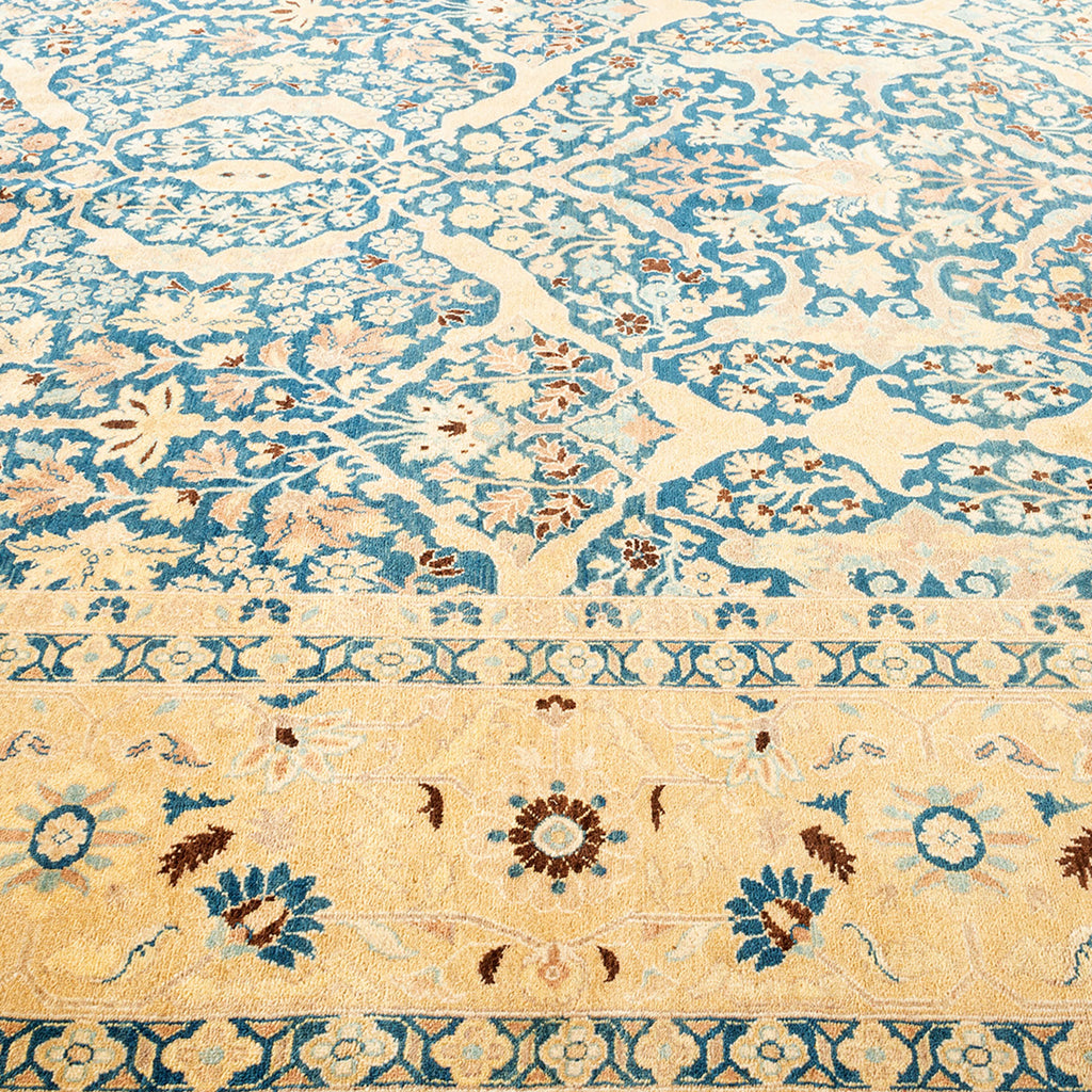 Intricate Persian/Oriental rug featuring floral and geometric patterns in blue.