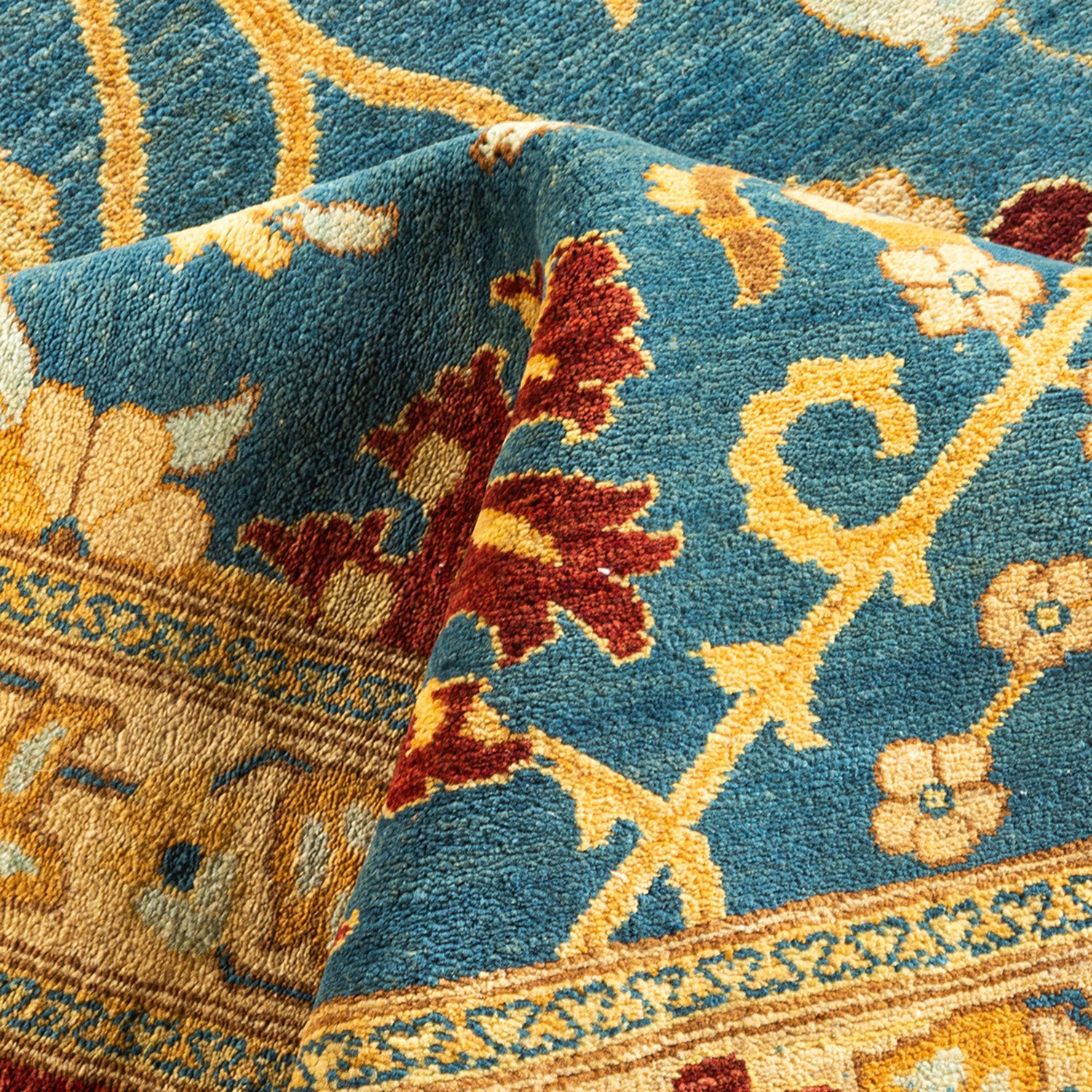 Close-up of textured fabric showcasing intricate floral rug pattern