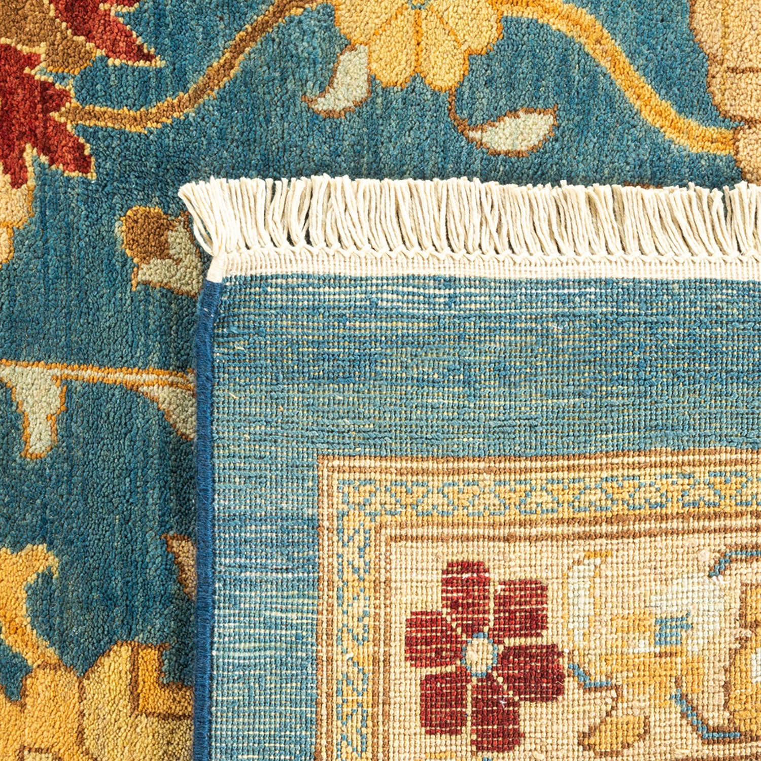 Close-up of a handcrafted woven rug with intricate floral design
