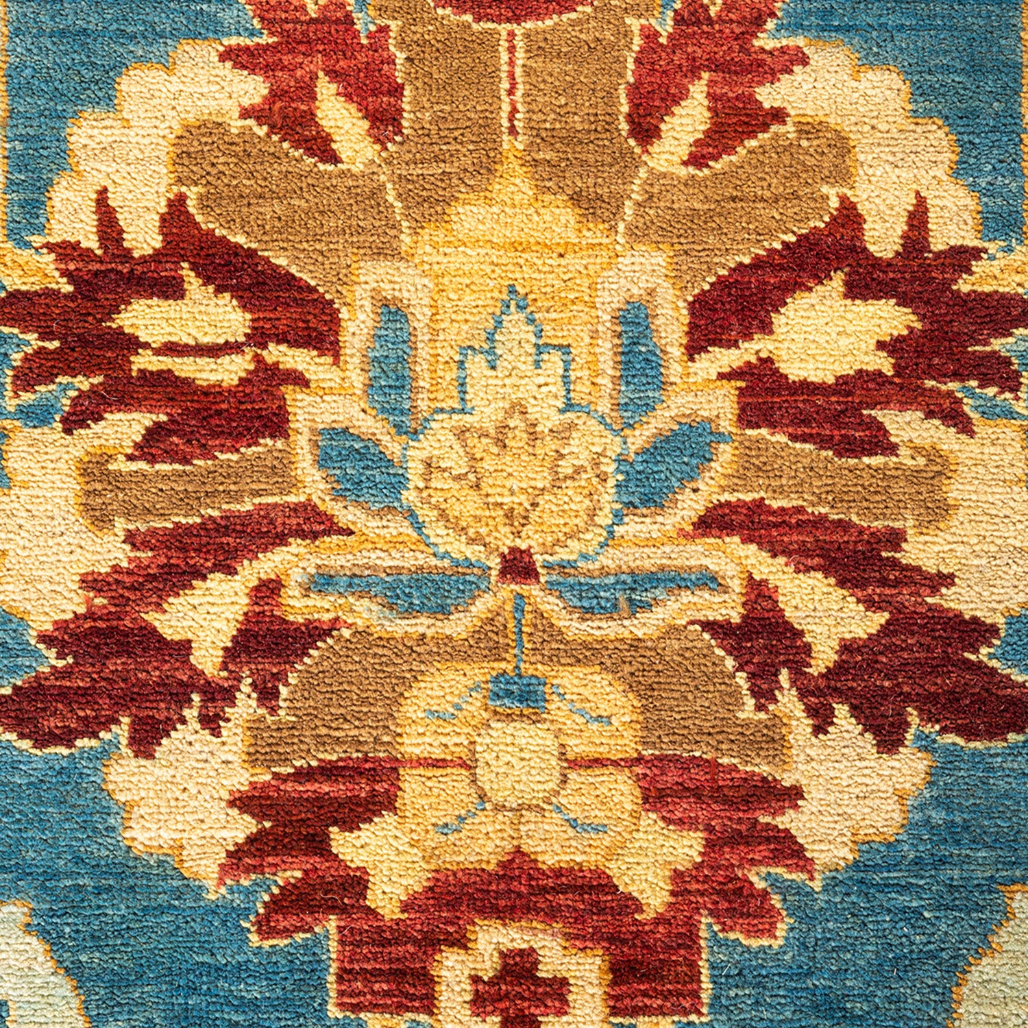 Intricate, symmetrical floral motifs in vibrant colors on textile.