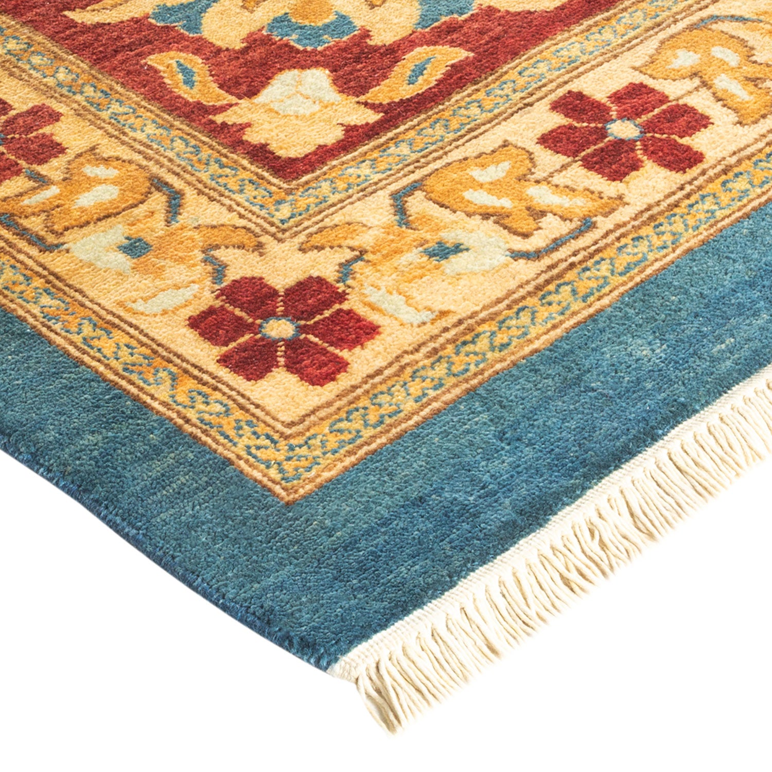 Intricately patterned traditional rug with warm color palette and fringe.
