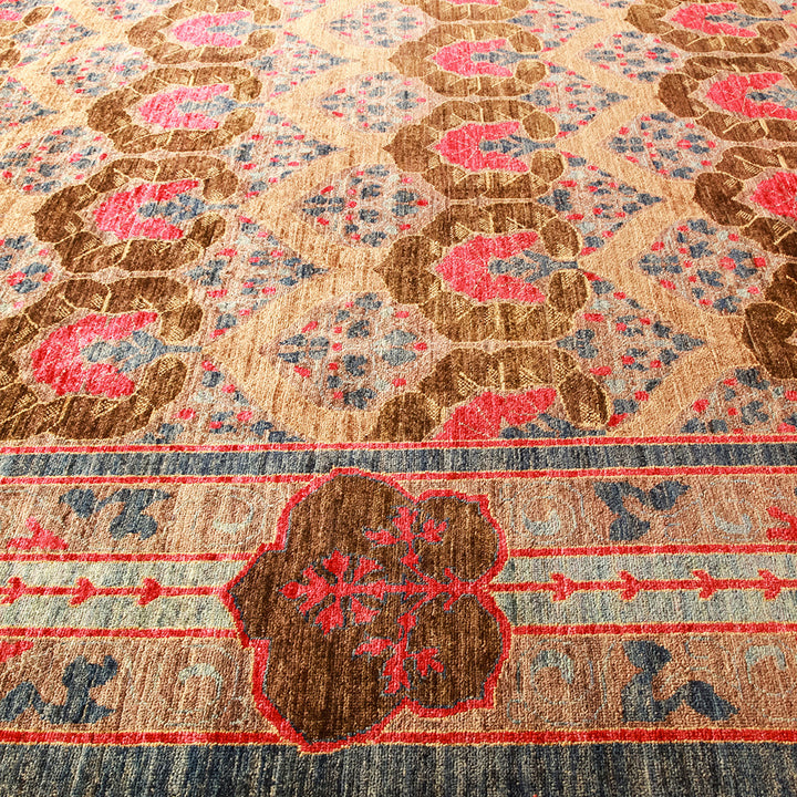 Vintage handcrafted carpet with intricate floral and geometric motifs.