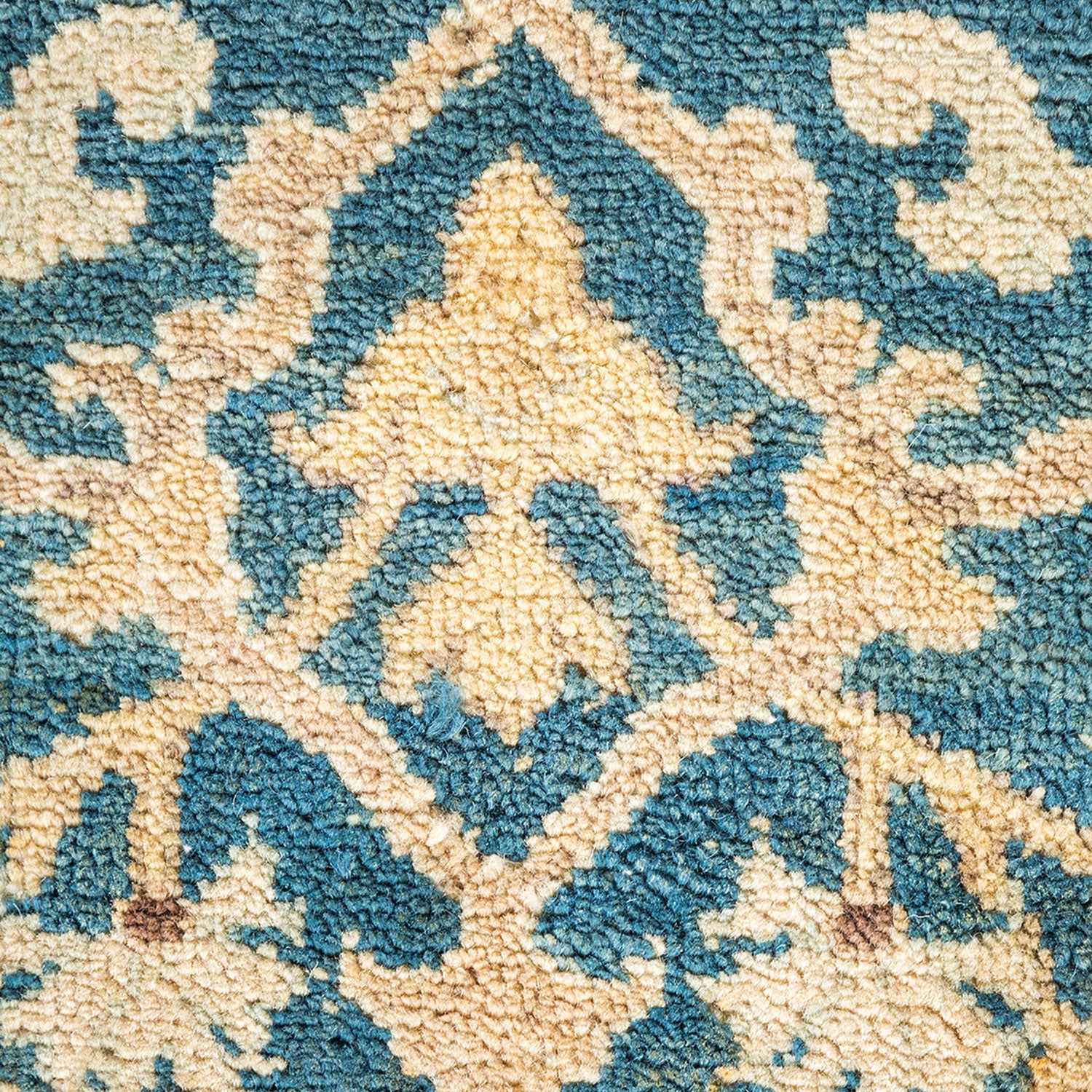 Close-up of a traditional Middle Eastern-inspired rug with wear