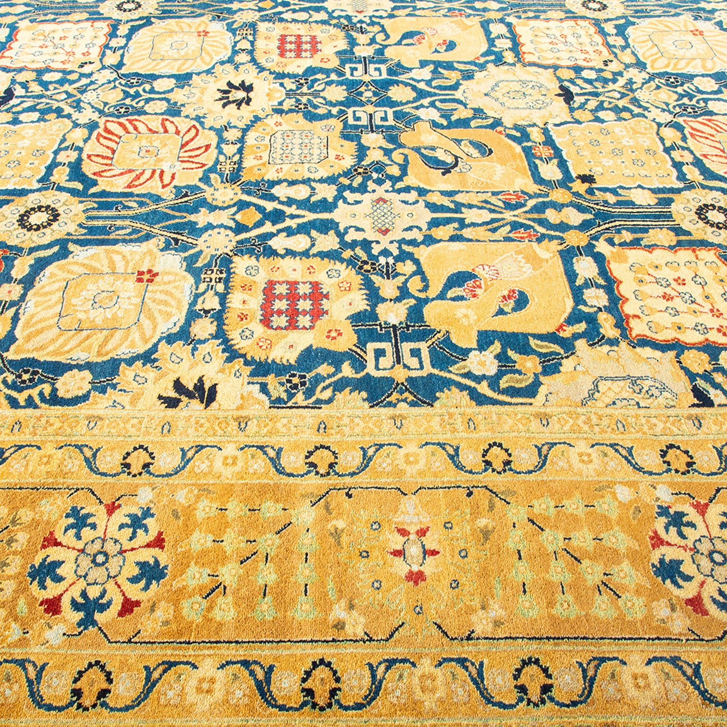 Exquisite handwoven Persian-style carpet featuring intricate floral and geometric patterns.