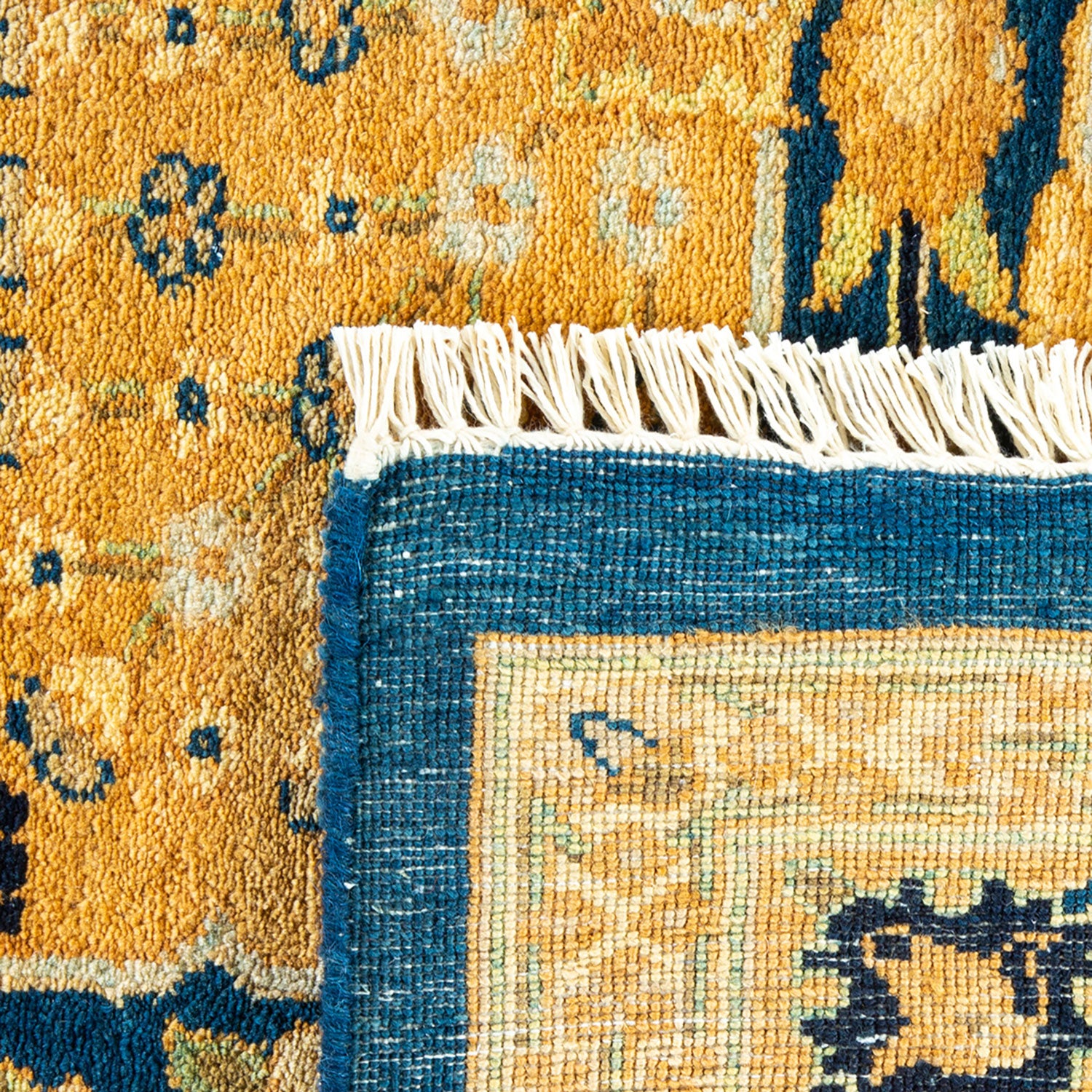 Close-up of a traditional oriental rug with intricate patterns and fine craftsmanship.