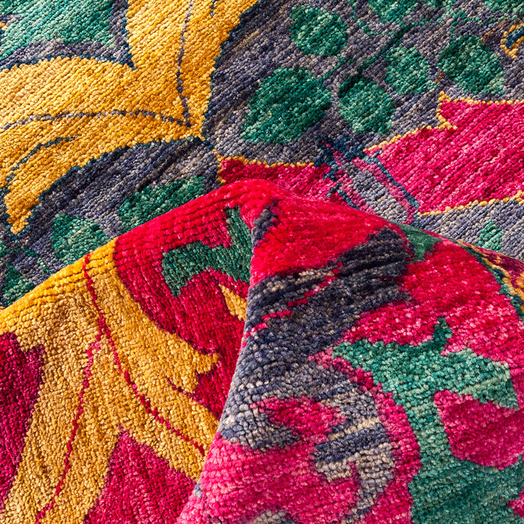 Close-up of a hand-woven, luxurious and colorful statement rug.