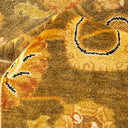 Detail of a plush, ornate patterned carpet in vibrant colors.