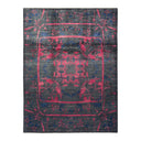 Vintage-inspired rug with a distressed look features intricate botanical design.