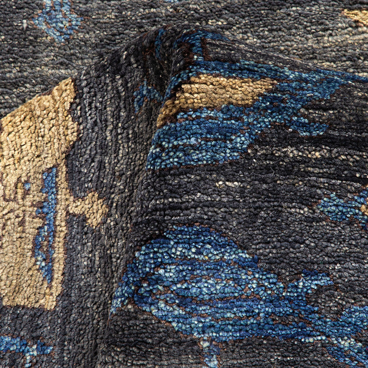 Close-up image of a textured fabric with abstract floral motif.