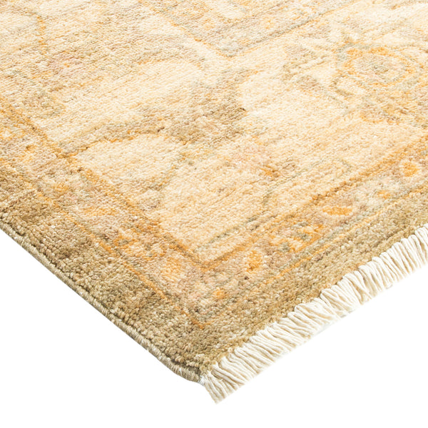 Hand-woven cream and beige rug with geometric diamond pattern.