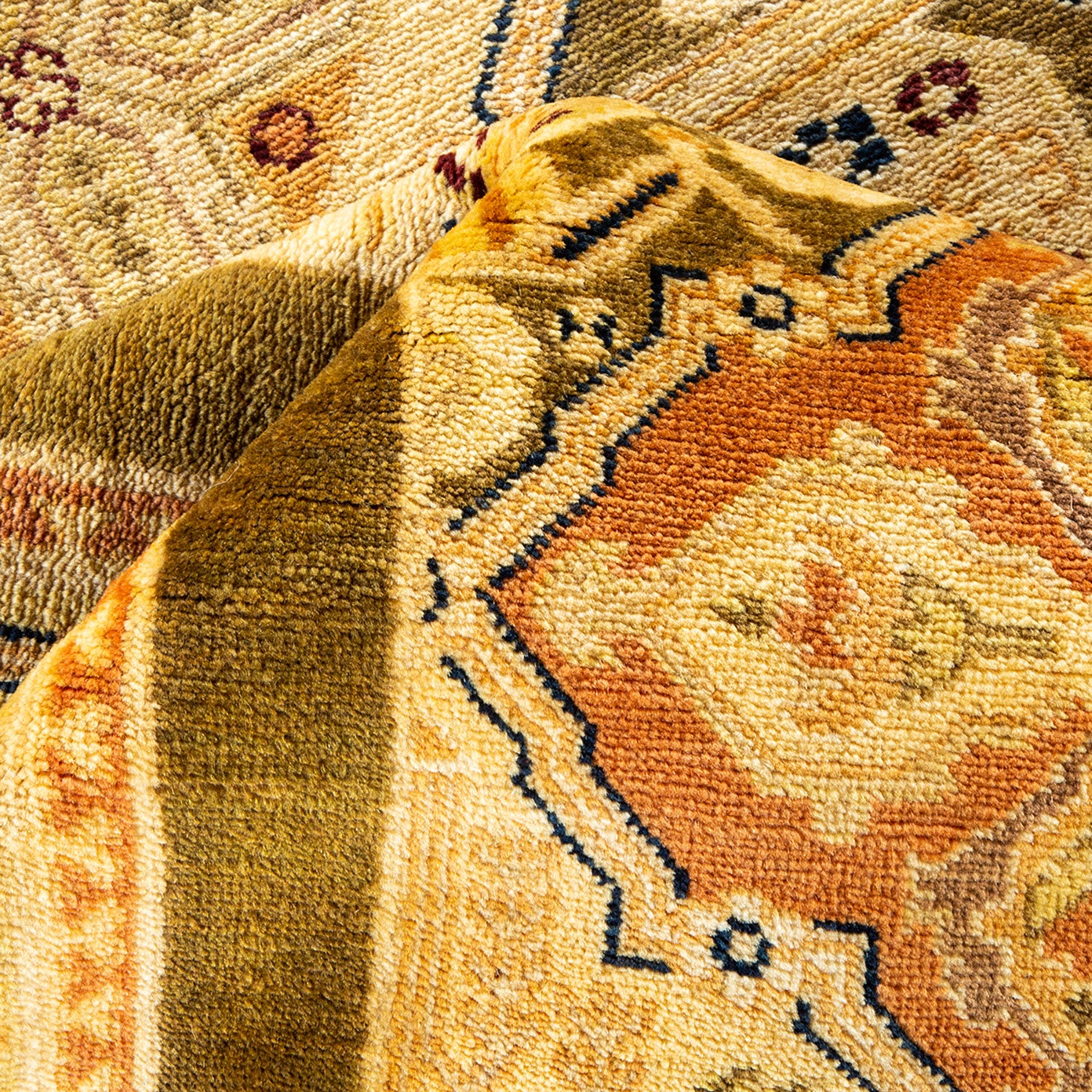 Close-up of a plush, multicolored woven rug with intricate patterns.
