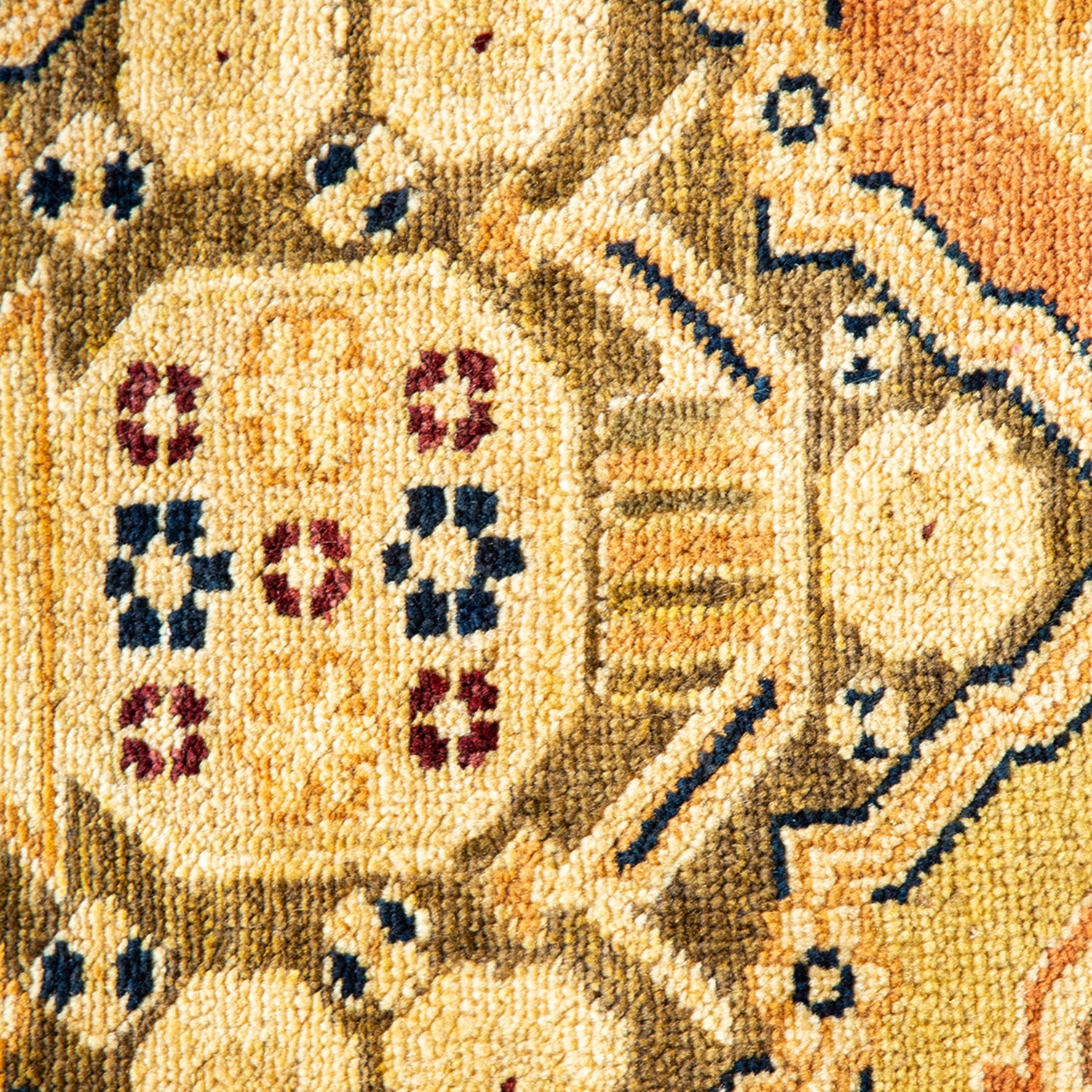Intricate, handcrafted rug with rich colors and symmetrical design.