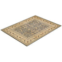 Intricate, symmetrical design of a traditional area rug in earth tones.