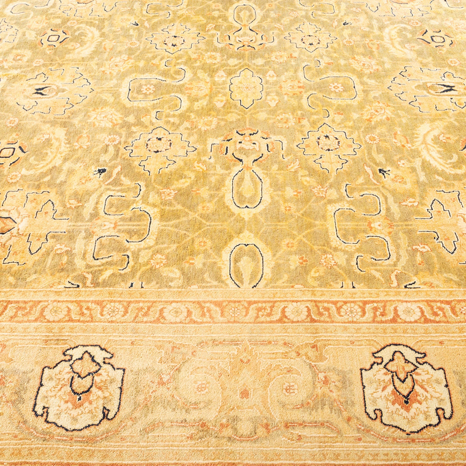 Intricate Persian carpet with symmetrical floral and geometric patterns.