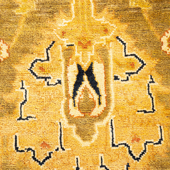 Intricate golden-yellow patterned fabric with geometric and floral motifs.