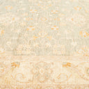 Close-up view of a vintage-inspired textured carpet with floral motifs
