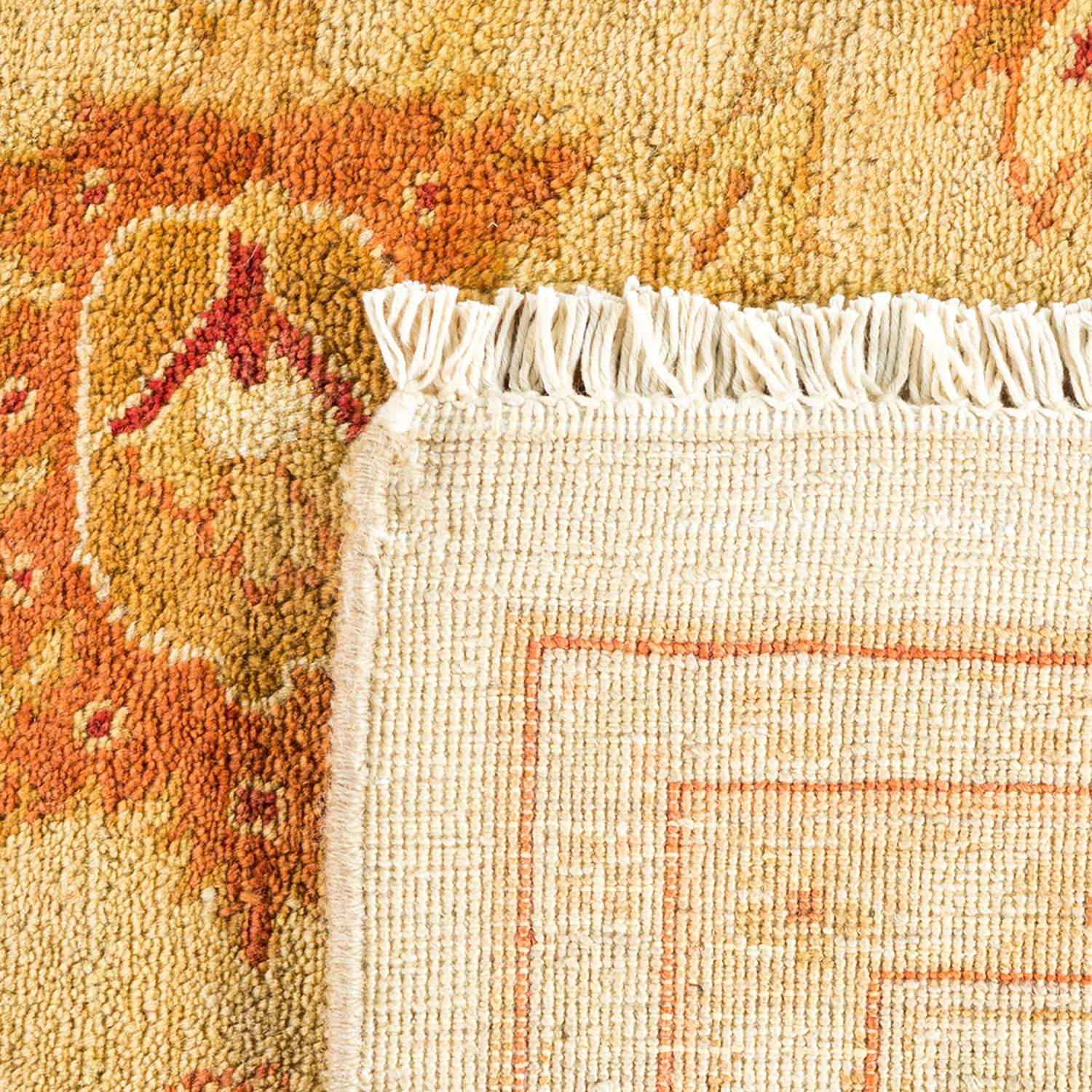 Detailed, traditional handwoven rug with fringe and intricate weave pattern.