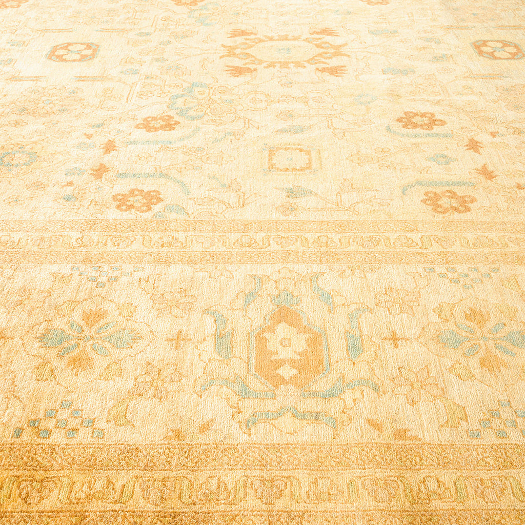 Intricately designed carpet showcases traditional motifs in a golden hue.