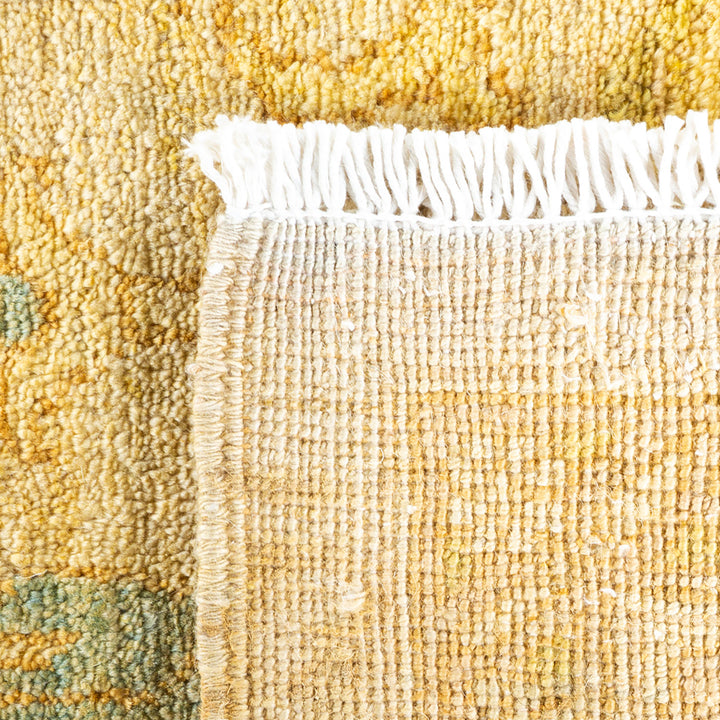 Close-up of a woven rug displaying rich colors and texture.