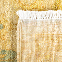 Close-up of a woven rug displaying rich colors and texture.