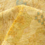 Close-up of a plush, yellow fabric with a subtle pattern.