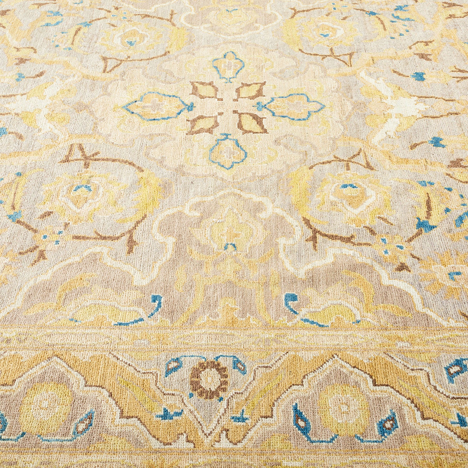 A close-up of a symmetrical, ornate carpet with soft textures.