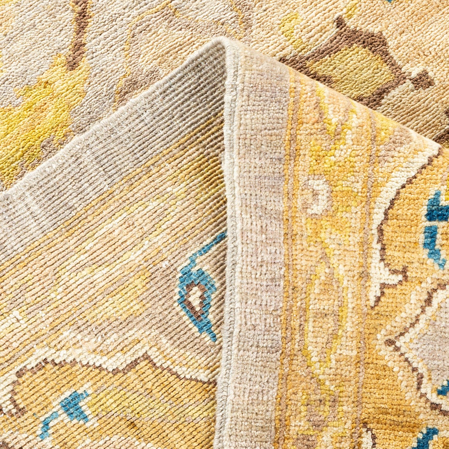 Close-up view of a high-quality, patterned rug with ornate design.