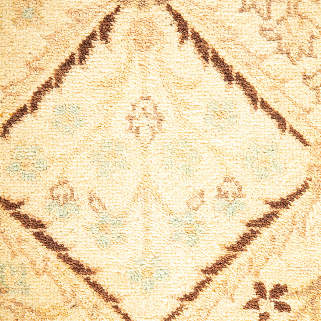 Close-up of a soft, plush carpet with intricate geometric motifs