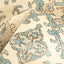 Close-up of a textured fabric with ornate blue and gray pattern.