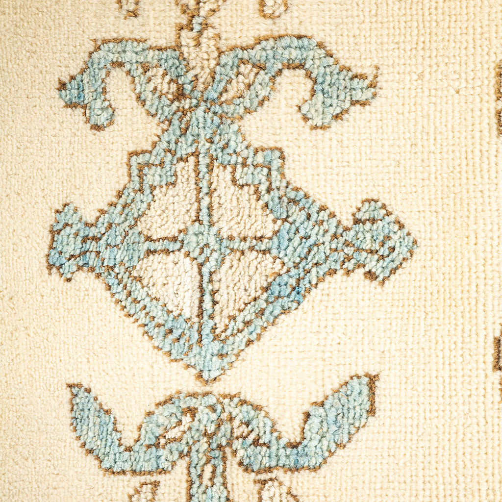 Close-up of a blue floral patterned textile with plush texture.