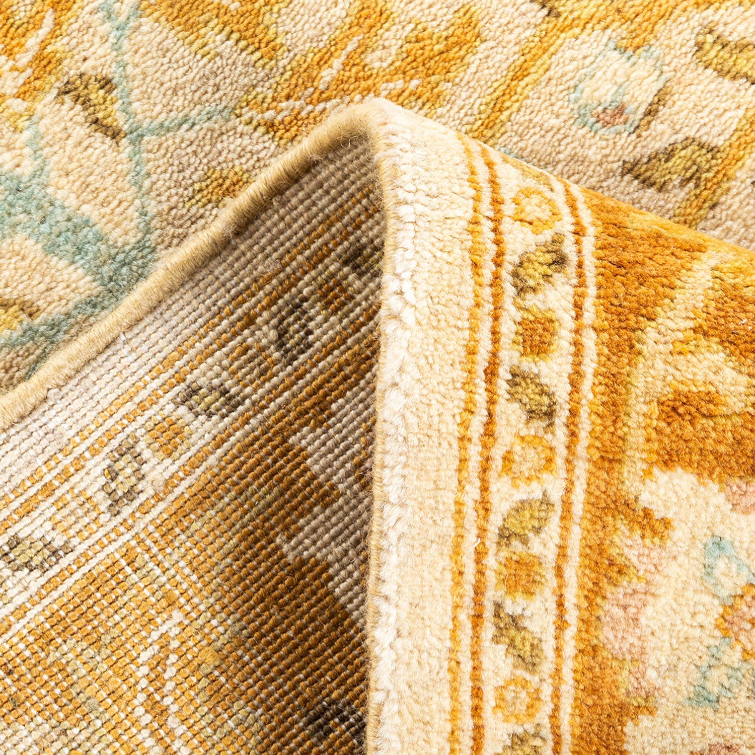 Vibrant and detailed close-up of high-quality folded area rug.
