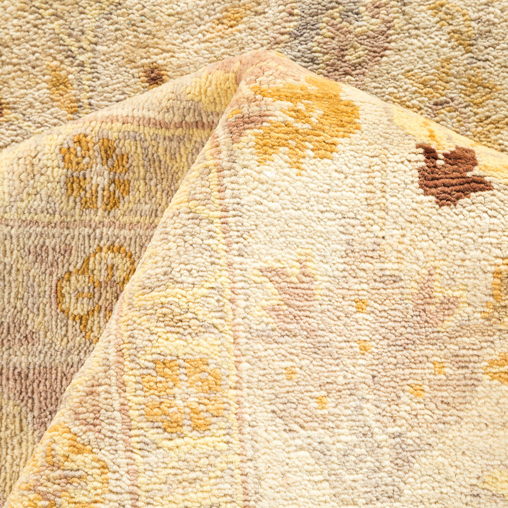 Close-up of a soft, textured carpet with neutral earthy tones