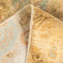 Close-up view of two contrasting rugs showcases texture and color.