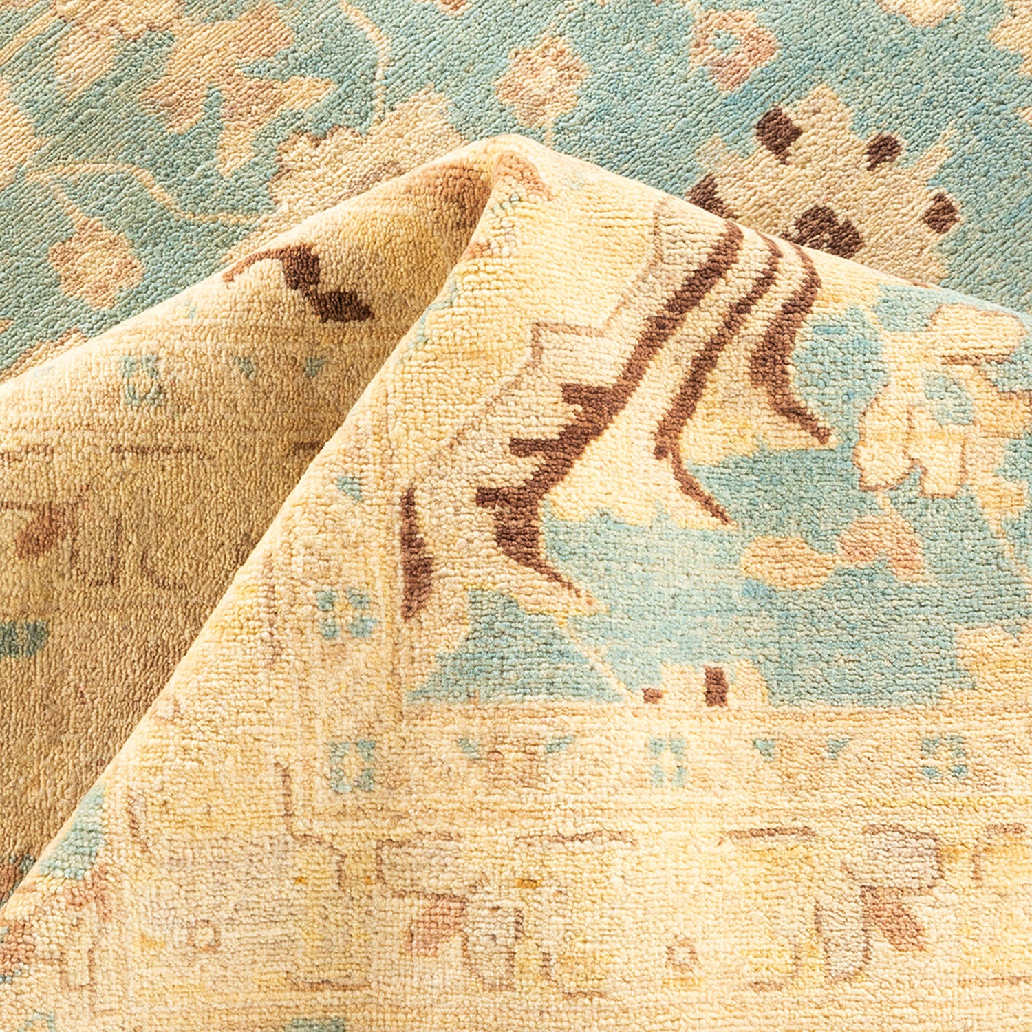 Close-up of a plush, well-crafted carpet with ornate patterns.