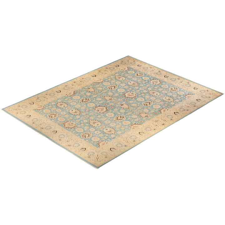 Intricate symmetrical patterned rug in shades of blue and accents.