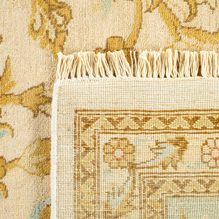 Close-up of a high-quality, traditional rug with intricate floral patterns